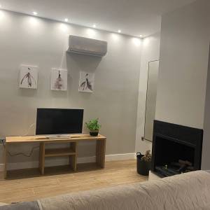 Salón y chimenea Casa Rural 12